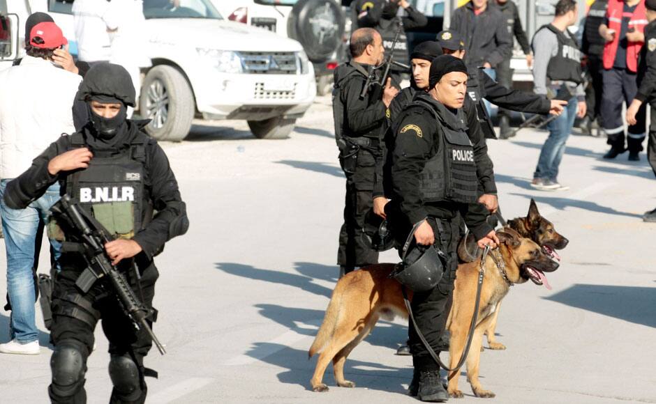 Police lead their dogs during the attack by gunmen on Tunisia's national museum in Tunis March 18, 2015. Gunmen in military uniforms stormed Tunisia's national museum, killing 17 foreign tourists and two Tunisians on Wednesday in one of the worst militant attacks in a country that has largely escaped the region's 