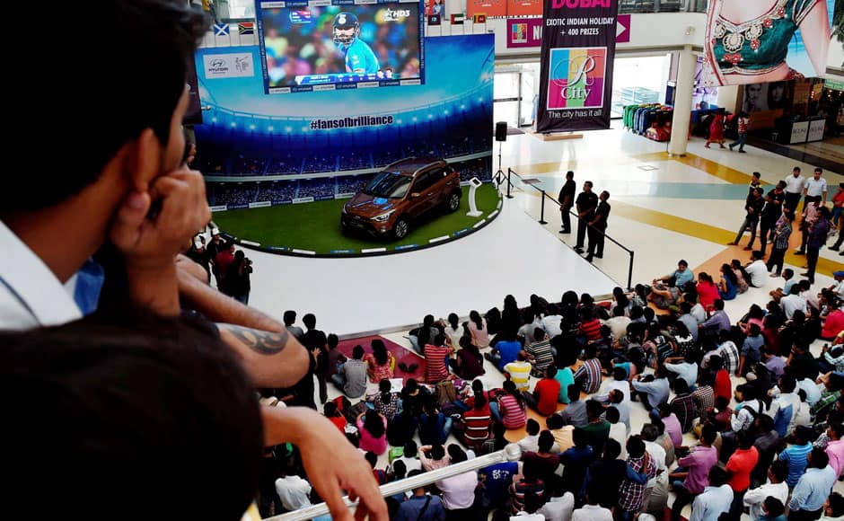 Mumbai: Cricket fans enjoy Cricket World Cup semi final match between India and Australia, in Mumbai on Thursday. PTI