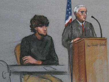  Boston Marathon bombing suspect Dzhokhar Tsarnaev, left, is depicted beside U.S. District Judge George O’Toole Jr., right, as O’Toole addresses a pool of potential jurors in a jury assembly room at the federal courthouse, in Boston. AP 