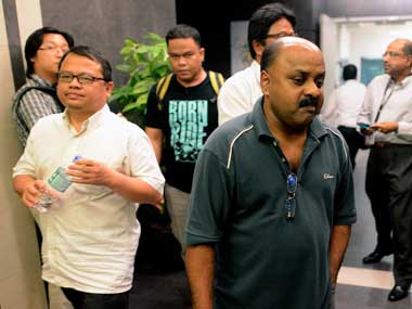 Managing Editor of The Malaysian Insider Lionel Morais (right) and Author Analysis and Plan Zulkifli Sulong (left) when brought to the Dang Wangi police station yesterday.