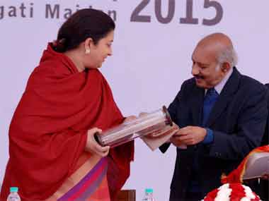 Sethumadhavan (right) with HRD minister Smriti Irani in a file photo. PIB image