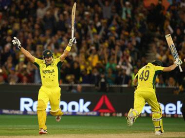 Watson and Smith celebrate after the latter hits the winning runs against New Zealand in the World Cup final. Getty