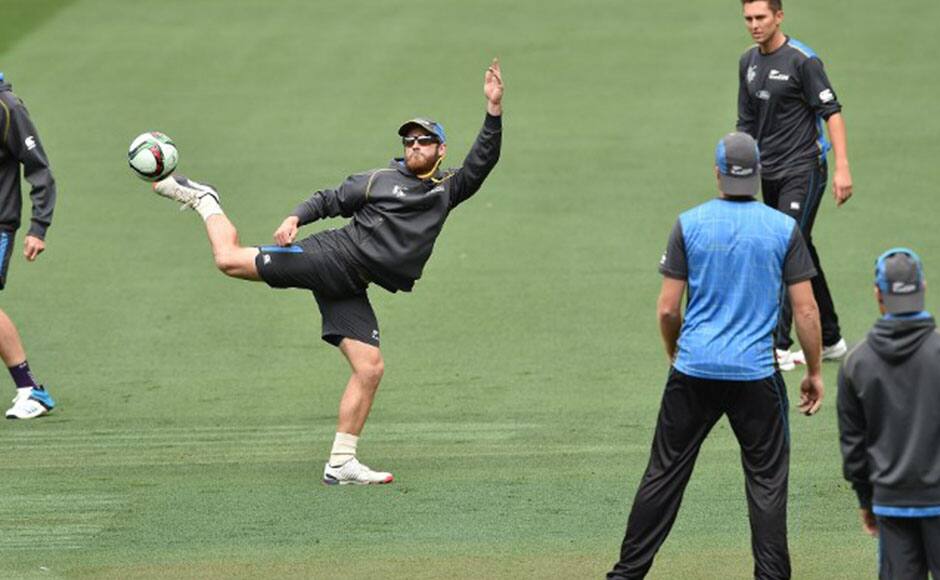  Kane Williamson (2L) kicks the ball while playing football during a training session. AFP