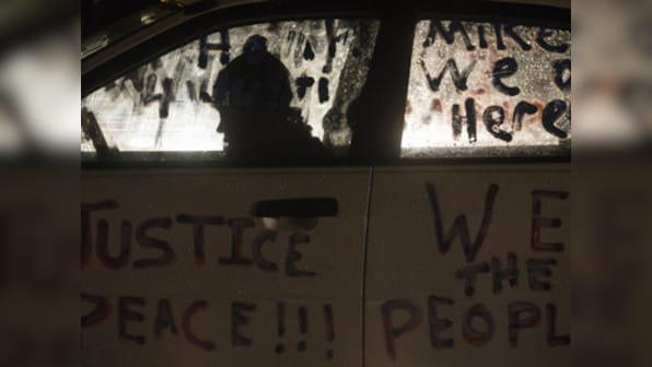 Michael Brown shooting: Calm prevails in Ferguson after 2 police officers were shot