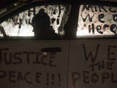 Michael Brown shooting: Calm prevails in Ferguson after 2 police officers were shot Michael Brown shooting: Calm prevails in Ferguson after 2 police officers were shot