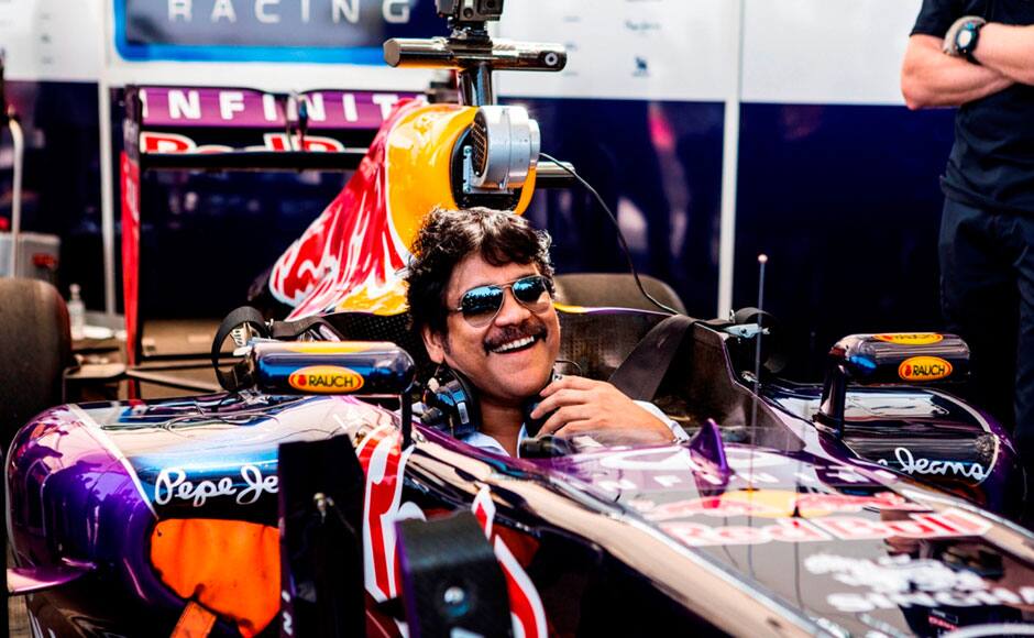 Tollywood actor Nagarjuna sits in the Formula One racing car of David Coulthard of the Infiniti Red Bull Racing team, in Hyderabad, India on April 5, 2015. Solaris Images