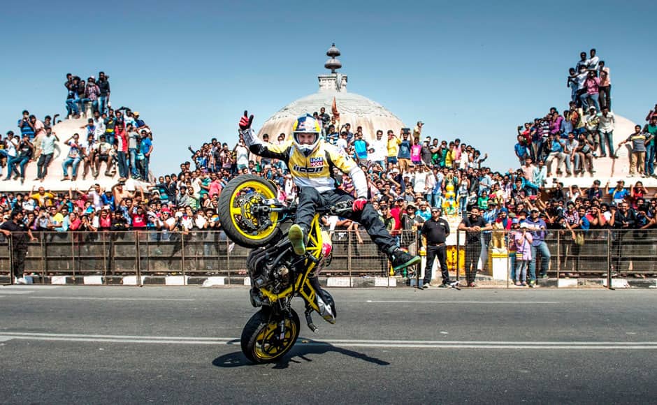 Lithuanian stunt rider Aras Gibieza performs near the Hussain Sagar lake in Hyderabad, India on April 5, 2015. The Red Bull F1 car and motorcycle stunt show was flagged off by Tollywood actor Akkineni Nagarjuna. Solaris Images