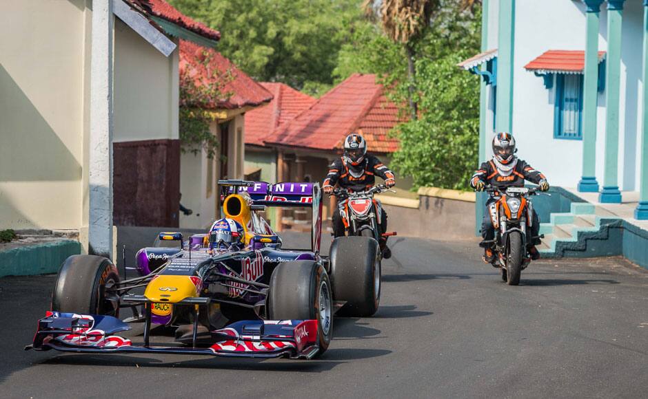 Former Formula One racing driver David Coulthard of the Infiniti Red Bull Racing team, drives through Ramoji film city in Hyderabad, India on April 5, 2015. The extreme noise of the F1 car coupled with the driving expertise of the legendary 13-time Grand Prix winner David Coulthard who touched a top speed of 282 kph, made the Red Bull F1 Show Run of Hyderabad an unforgettable experience for motorsports enthusiasts. The event was flagged offf by Tollywood actor Akkineni Nagarjuna. Solaris Images