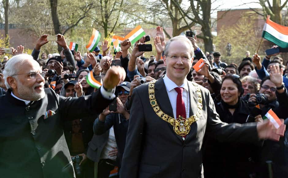 Hannover: Prime Minister Narendra Modi with Mayor of Hannover, Stefan Schostok waves to people after unveiling the bust of Mahatma Gandhi, at Culemannstrasse, in Hannover, Germany on Sunday.    PTI