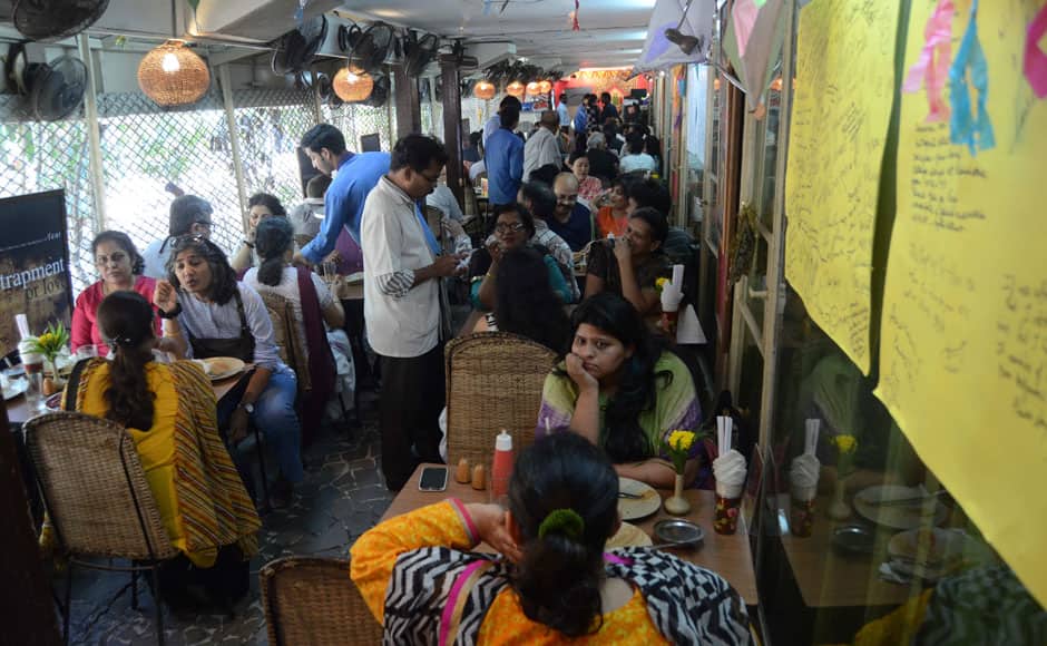 A waiter takes orders from patrons on the last day of Cafe Samovar, in Mumbai, India on March 31, 2015. Cafe Samovar, the 50 year old eatery, a cultural and tourist destination synonymous with art, culture, literature, theatre and an integral part of being a Mumbaikar, lost out on its space in Jehangir Art Gallery after a court order. Solaris Images