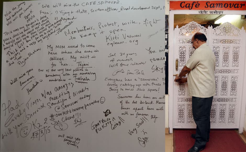 Cafe Samovar cashier Mohanan locks the door on the last day of Cafe Samovar, in Mumbai, India on March 31, 2015. Cafe Samovar, the 50 year old eatery, a cultural and tourist destination synonymous with art, culture, literature, theatre and an integral part of being a Mumbaikar, lost out on its space in Jehangir Art Gallery after a court order. Solaris Images