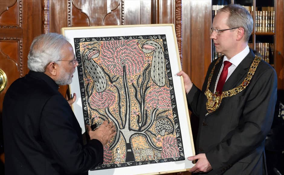 Hannover: Prime Minister Narendra Modi gives a gift to the Lord Mayor of Hannover, Stefan Schostok, in Hannover, Germany on Sunday.     PTI