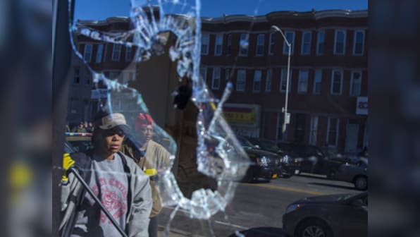 Baltimore on edge: Obama raises questions on race relations as riot control took over city