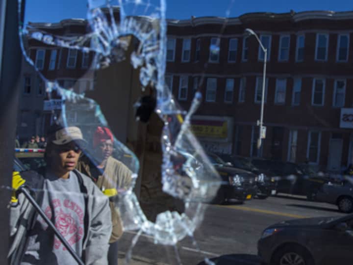 Baltimore on edge: Obama raises questions on race relations as riot control took over city