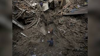 Nepal: Crowds roar and cheer as teenage boy rescued after five days under rubble 