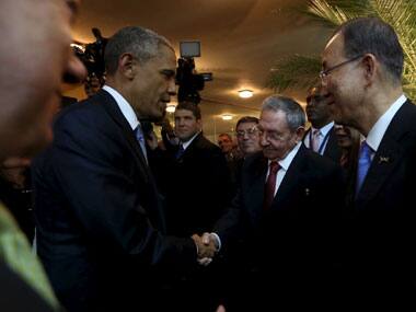 US President Barack Obama (left) shakes hands with Cuban counterpart Raul Castro as UN Secretary-General Ban Ki-moon looks on. Reuters