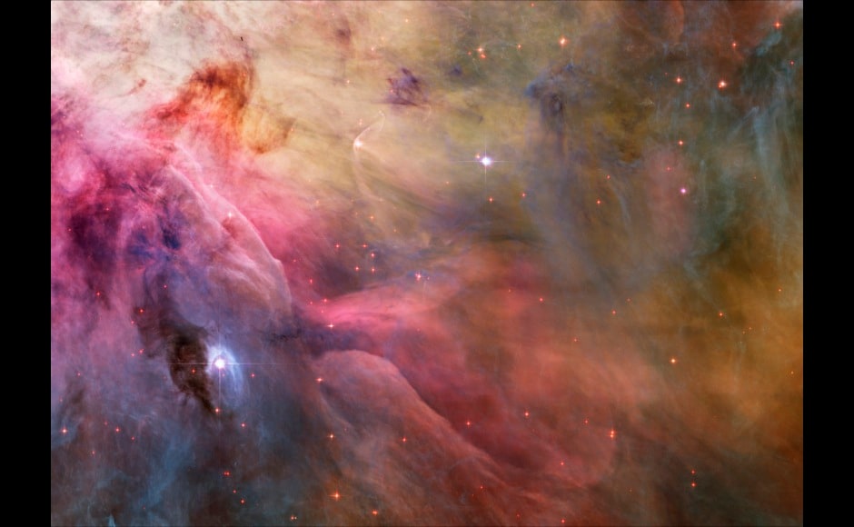 NASA illustration shows aesthetic close-up of cosmic clouds and stellar winds featuring LL Orionis, interacting with the Orion Nebula flow in this image released on February 4, 2013. Adrift in Orion's stellar nursery and still in its formative years, variable star LL Orionis produces a wind more energetic than the wind from our own middle-aged Sun. This picture is part of a large mosaic view of the complex stellar nursery in Orion, filled with a myriad of fluid shapes associated with star formation. REUTERS/NASA, ESA and the Hubble Heritage Team/Handout (OUTER SPACE - Tags: ENVIRONMENT SCIENCE TECHNOLOGY) FOR EDITORIAL USE ONLY. NOT FOR SALE FOR MARKETING OR ADVERTISING CAMPAIGNS. THIS IMAGE HAS BEEN SUPPLIED BY A THIRD PARTY. IT IS DISTRIBUTED, EXACTLY AS RECEIVED BY REUTERS, AS A SERVICE TO CLIENTS - RTR3DCJW