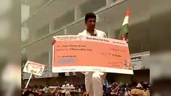 Account No. 420: Cong hands out fake Rs 15 lakh cheques as protest ...