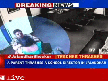 Bizarre! Watch mother thrashing school director for confiscating daughter's cell phone Bizarre! Watch mother thrashing school director for confiscating daughter's cell phone