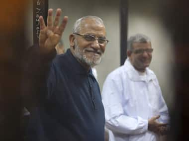 Muslim Brotherhood's Supreme Guide Mohamed Badie as he stands behind bars during his trial with ousted Egyptian President Mohamed Morsi in Cairo. Reuters