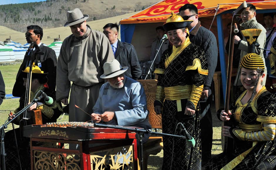 The Prime Minister, Shri Narendra Modi playing a traditional Mongolian music instrument at Mini Naadam Festival, in Ulaanbaatar, Mongolia on May 17, 2015. PIB