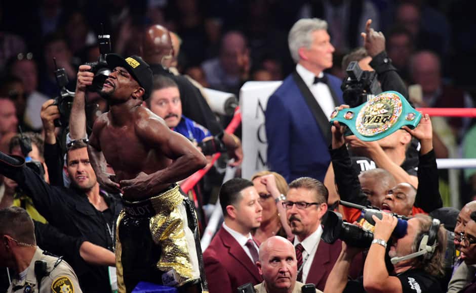 Las Vegas, NV, USA; Floyd Mayweather celebrates after defeating Manny Pacquiao (not pictured) via unanimous decision during their world welterweight championship bout at MGM Grand Garden Arena. Photo Credit: Joe Camporeale-USA TODAY Sports