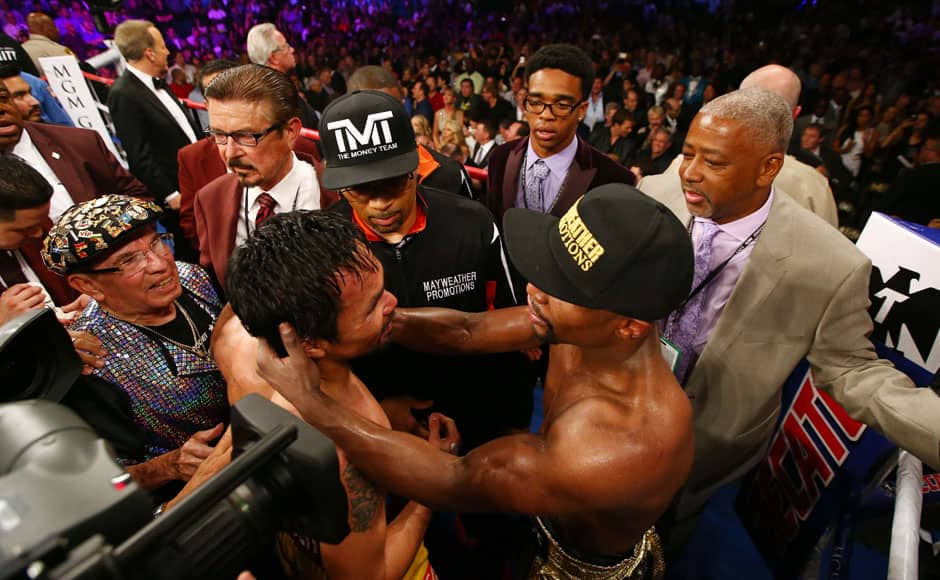 Las Vegas, NV, USA; Floyd Mayweather Jr with Manny Pacquiao after their world championship welterweight bout at the MGM Grand Garden Arena. Photo Credit: Mark J. Rebilas-USA TODAY Sports