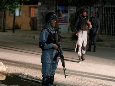 Afghan security forces at the site of the Park Palace Hotel. AP 