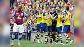 Walcott, Sanchez on target as Arsenal lift FA Cup for record 12th time