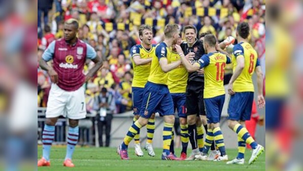 Walcott, Sanchez on target as Arsenal lift FA Cup for record 12th time