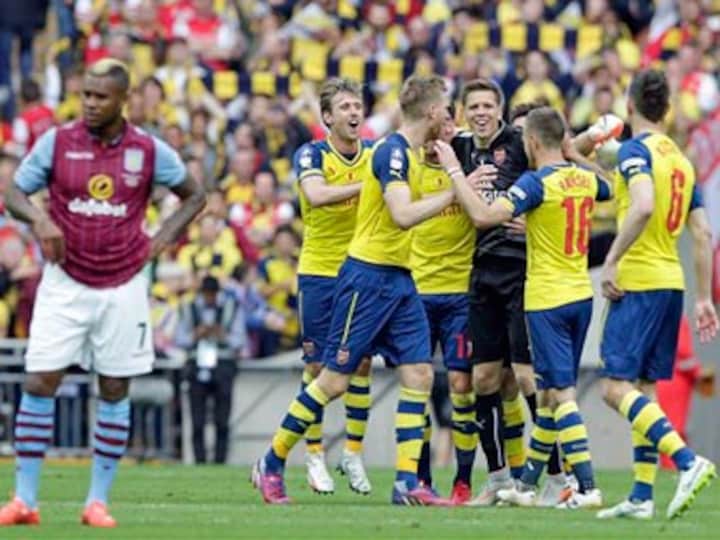 Walcott, Sanchez on target as Arsenal lift FA Cup for record 12th time