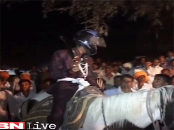 Dalit groom forced to wear helmet as upper caste Hindus hurl stones