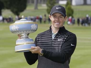 Rory McIlroy with the trophy. AP
