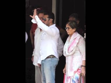 Salman Khan waving at fans before he leaves for court. Solaris Images.