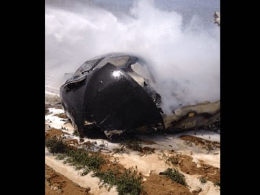 A handout picture taken and released on 9 May by Bomberos del Ayuntamiento de Sevilla shows wreckage of an Airbus A400M military transport plane. AFP