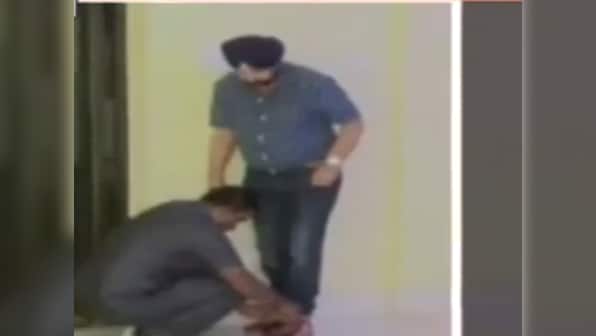 Have power, will abuse: Bengal minister makes security guard tie his shoelaces