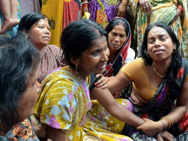 A woman mourns the death of her husband in the earthquake in Bihar. AFP