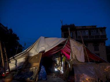 Local residents gather inside their temporary makeshift shelter after a fresh 7.3 earthquake struck, in Bhaktapur, Nepal. Reuters