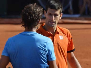Rafael Nadal and Novak Djokovic shake hands after the quarter-final match. AFP