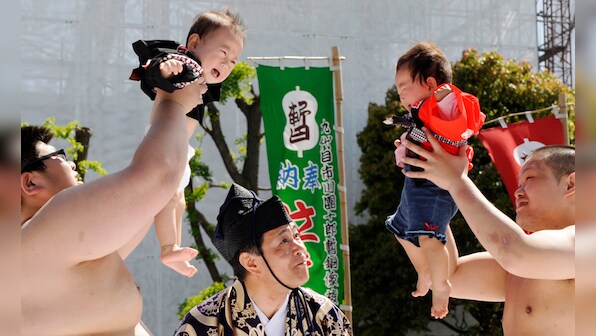 Bawl of a time: Tearful Japanese toddlers face off in annual 'crying sumo' competition