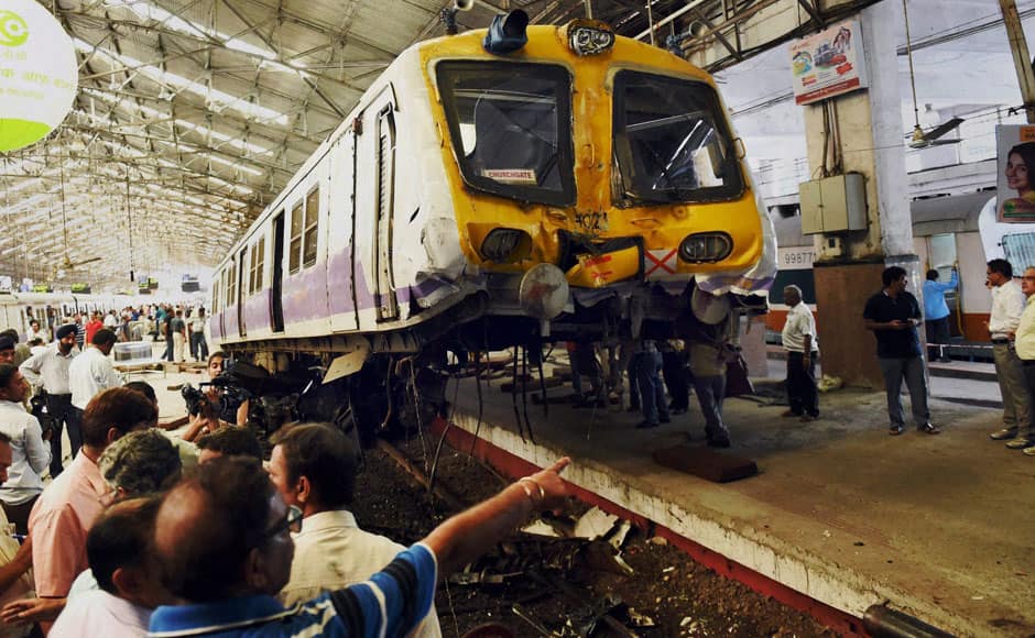 Mumbai: Officials of Accident Relief Train (ART) at work after local train derailed from its platform and climbed onto concourse at Churchgate station in Mumbai on Sunday. PTI