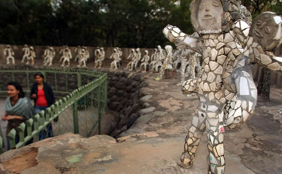 An Indian visitor looks at sculptures at the Rock Garden in Chandigarh on February 2, 2009. The Rock Garden, which spreads over 40 acres, was built by Indian man Nek Chand from industrial and home waste and other disgarded items. AFP 