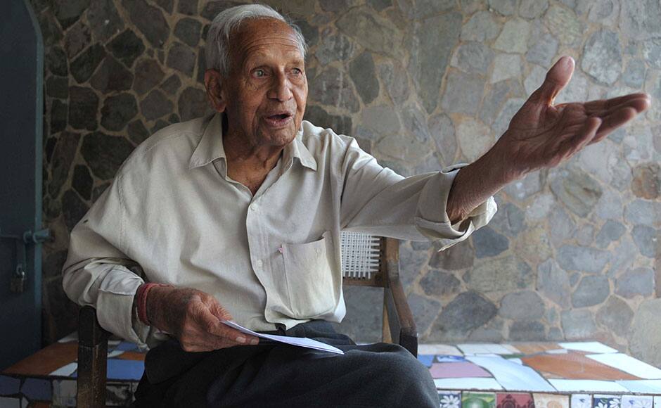 This photo taken on October 31, 2014 shows self-taught Indian artist Nek Chand Saini talking to journalists on the eve of his 90th birthday at the rock garden that he built in Chandigarh. Deep inside his massive garden of handmade waterfalls and sculptures, Nek Chand recalls toiling away secretly in the dead of night for a staggering 18 years to create his wonderland in north India. Riding his bicycle after dark to a state-owned forest, Chand spent night after night clearing patches of ground and transforming the landscape into a majestic garden that would eventually cover 20 acres (8 hectares). AFP