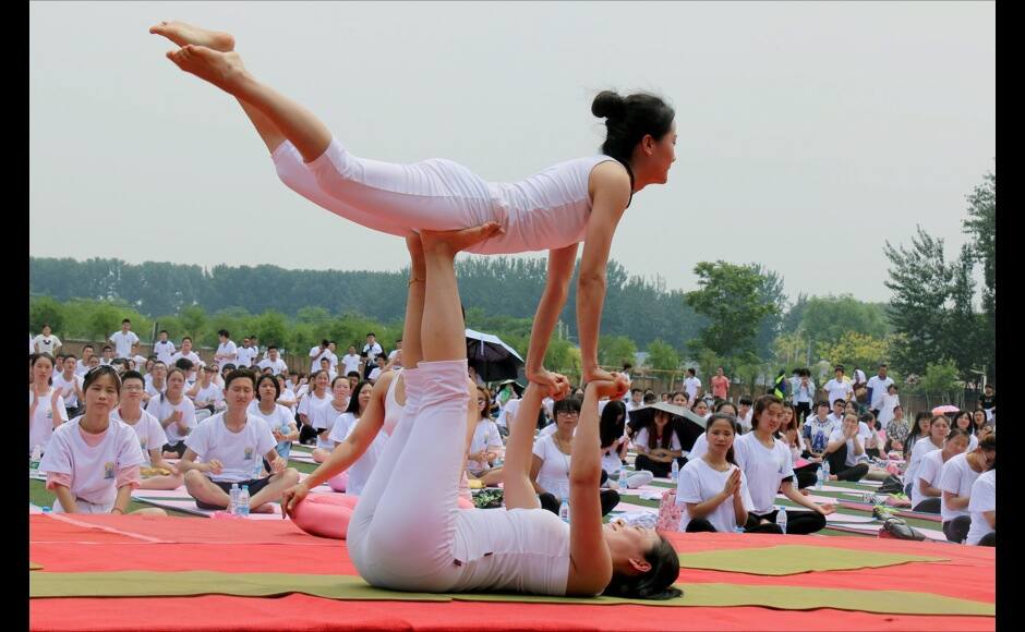 Beijing: Yoga enthusiasts perform at a session to mark World Yoga Day in Beijing on Sunday. PTI