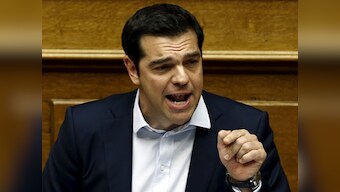 Greece govt suffers defections as austerity vote looms