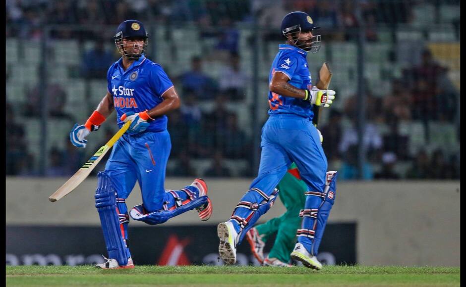 India’s Ravindra Jadeja, right, and Suresh Raina run between the wickets during the first one-day international cricket match against Bangladesh in Dhaka, Bangladesh, Thursday, June 18, 2015. (AP Photo/ A.M. Ahad) 
