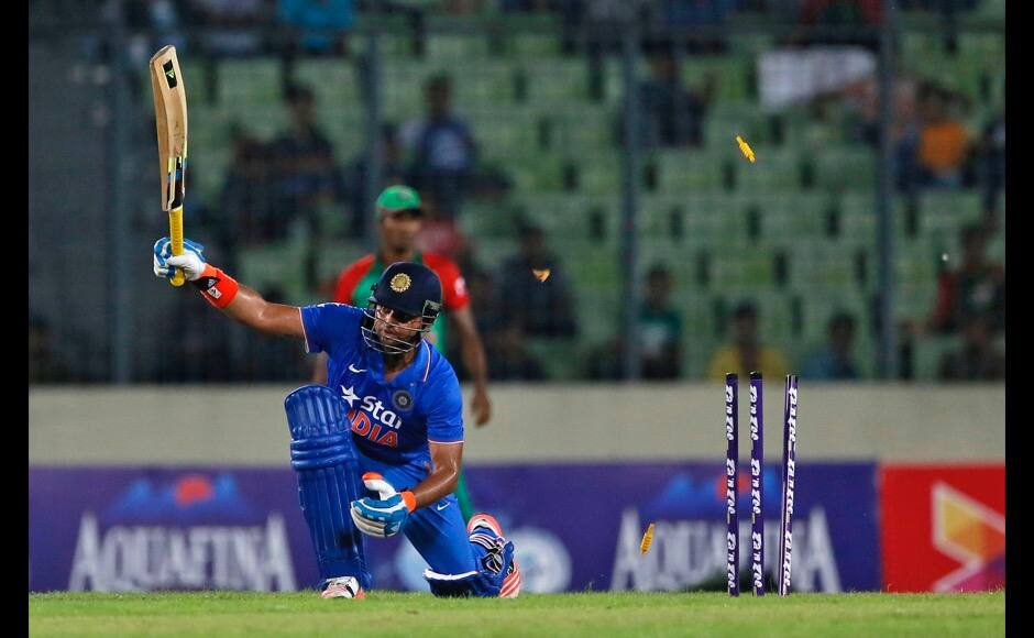 India’s Suresh Raina is bowled out by Bangladesh’s Mustafizur Rahman during the first one-day international cricket match between them in Dhaka, Bangladesh, Thursday, June 18, 2015. (AP Photo/ A.M. Ahad)