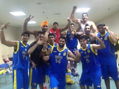 The men's basketball team celebrates after beating China. Twitter