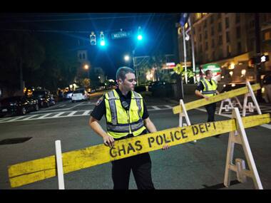 Police close off a section of Calhoun Street near the Emanuel AME Church following the shooting. AP