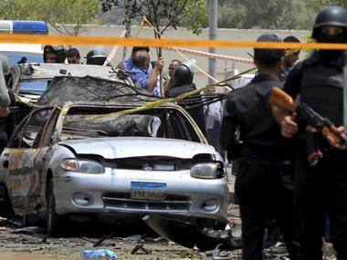 Police inspect the site of the car bomb. Reuters